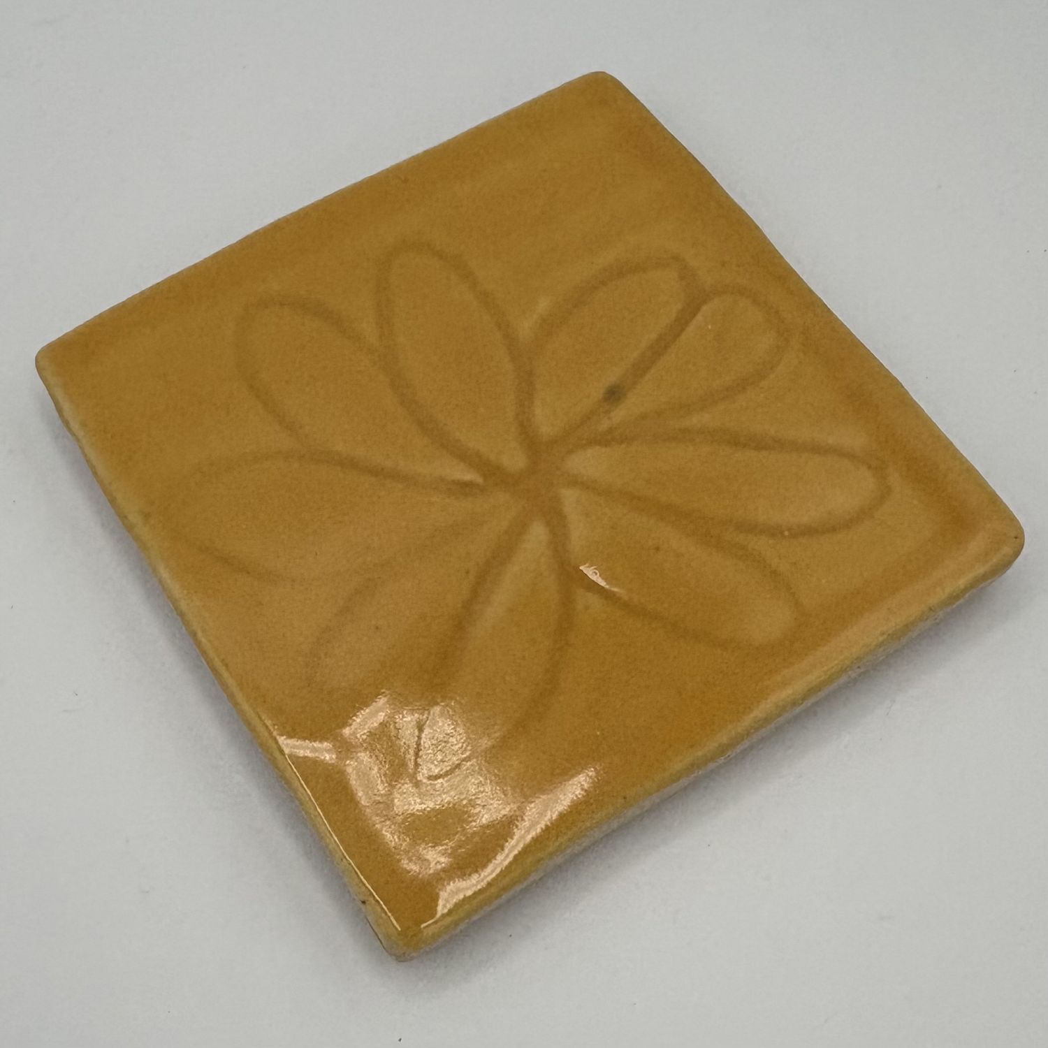 Erica Hasler, Ceramic Coaster, Flower on Yellow 1