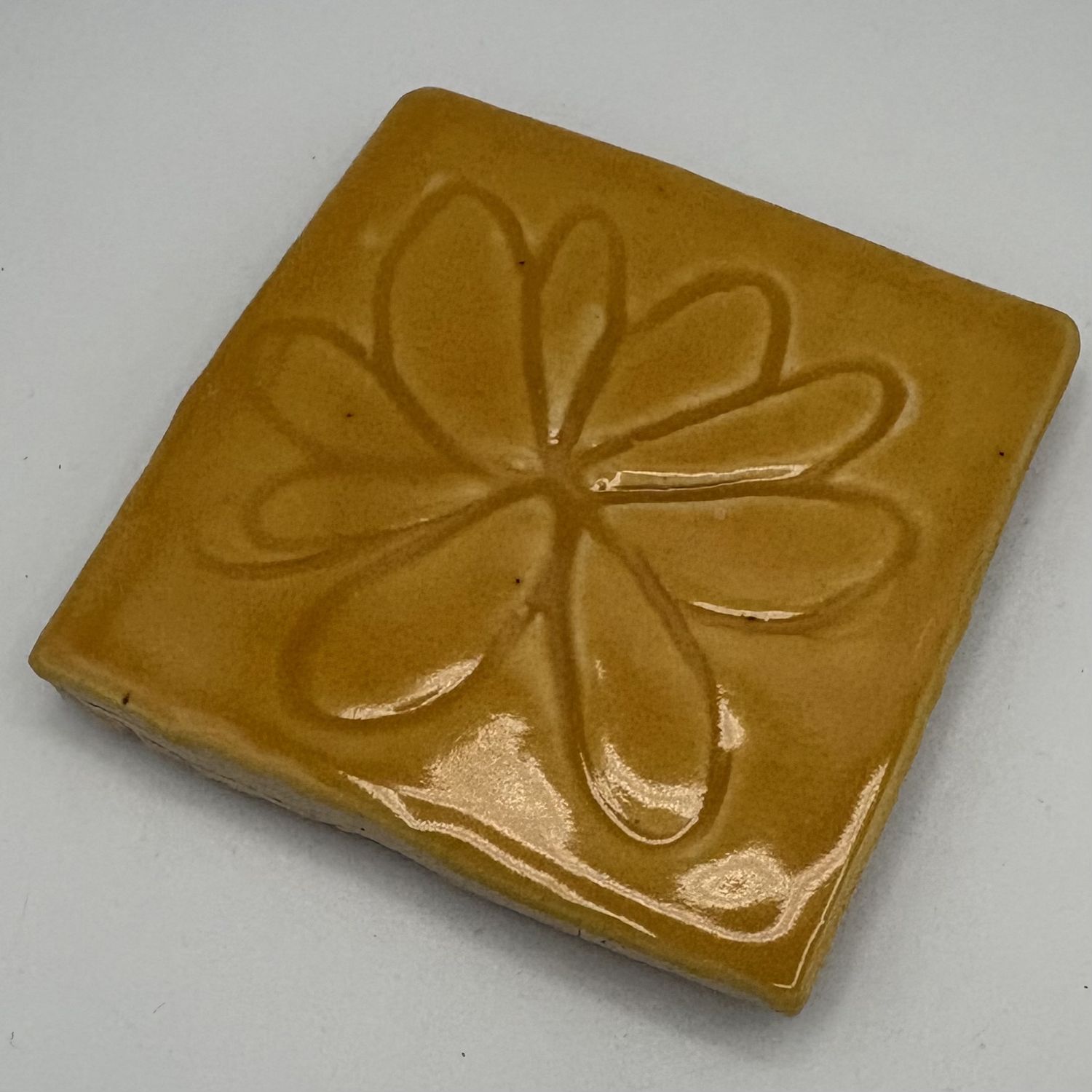 Erica Hasler, Ceramic Coaster, Flower on Yellow 2