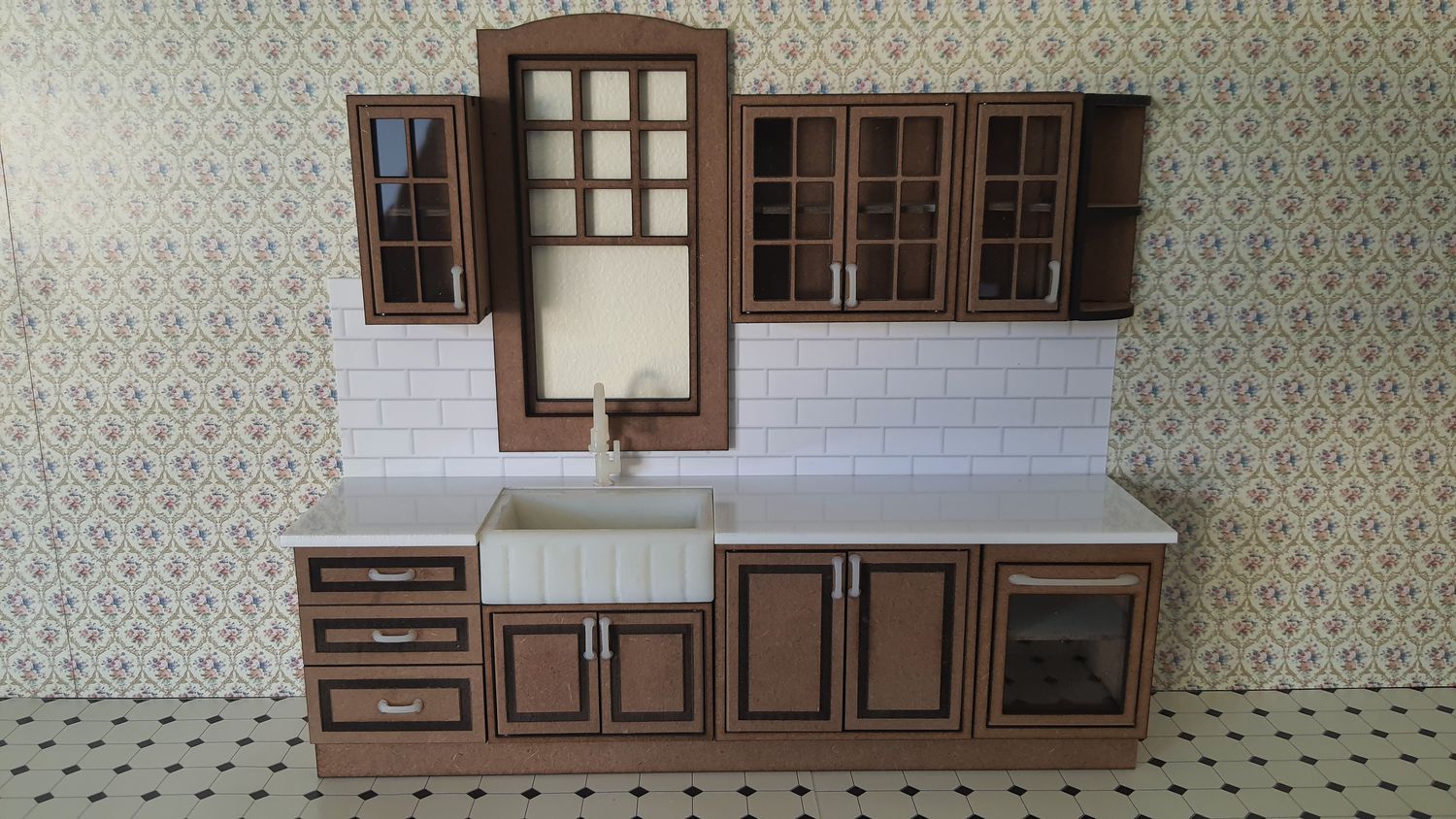 1:12th scale miniature Dolls House Kitchen. This is a DIY kit and has working doors. Kitchen floor base units.