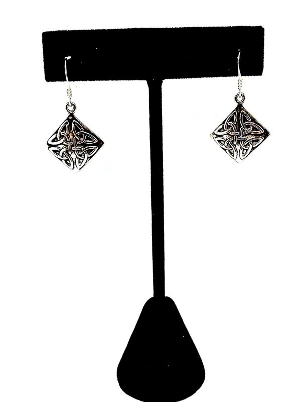 Sterling silver small to medium weight, small to medium sized perfectly squared earrings with four Trinities in each on a solid oxidized panel tied each together in the centre. The purpose of the oxidation of the panels is to illustrate the Trinities. The earrings are squared but styled in a diamond shape. The Trinity is an ancient Celtic symbol representing the eternal bind between the person, the planet and the soul. 