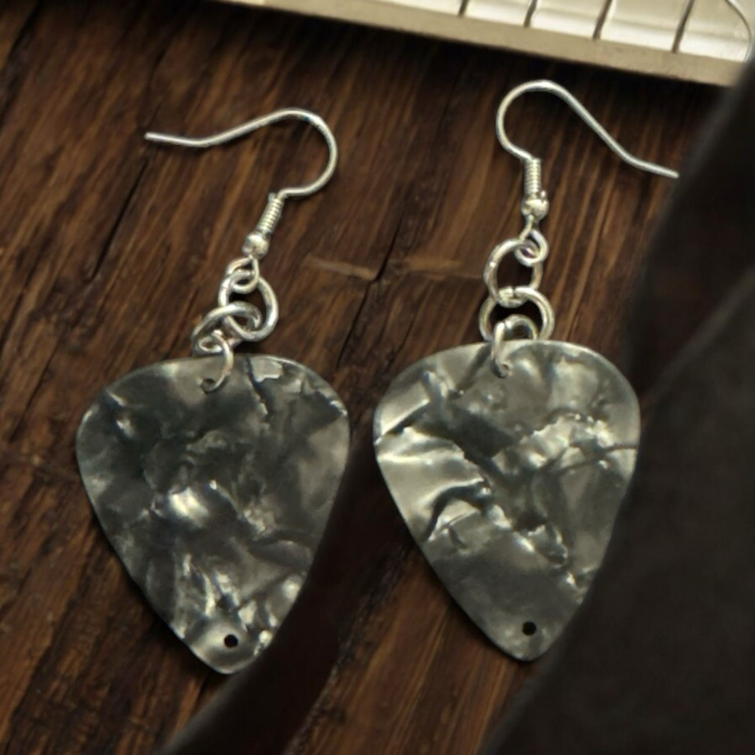 Black guitar pick earrings