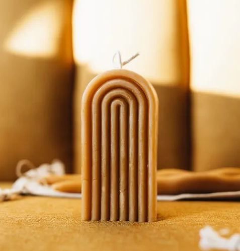 Golden rainbow beeswax candle
