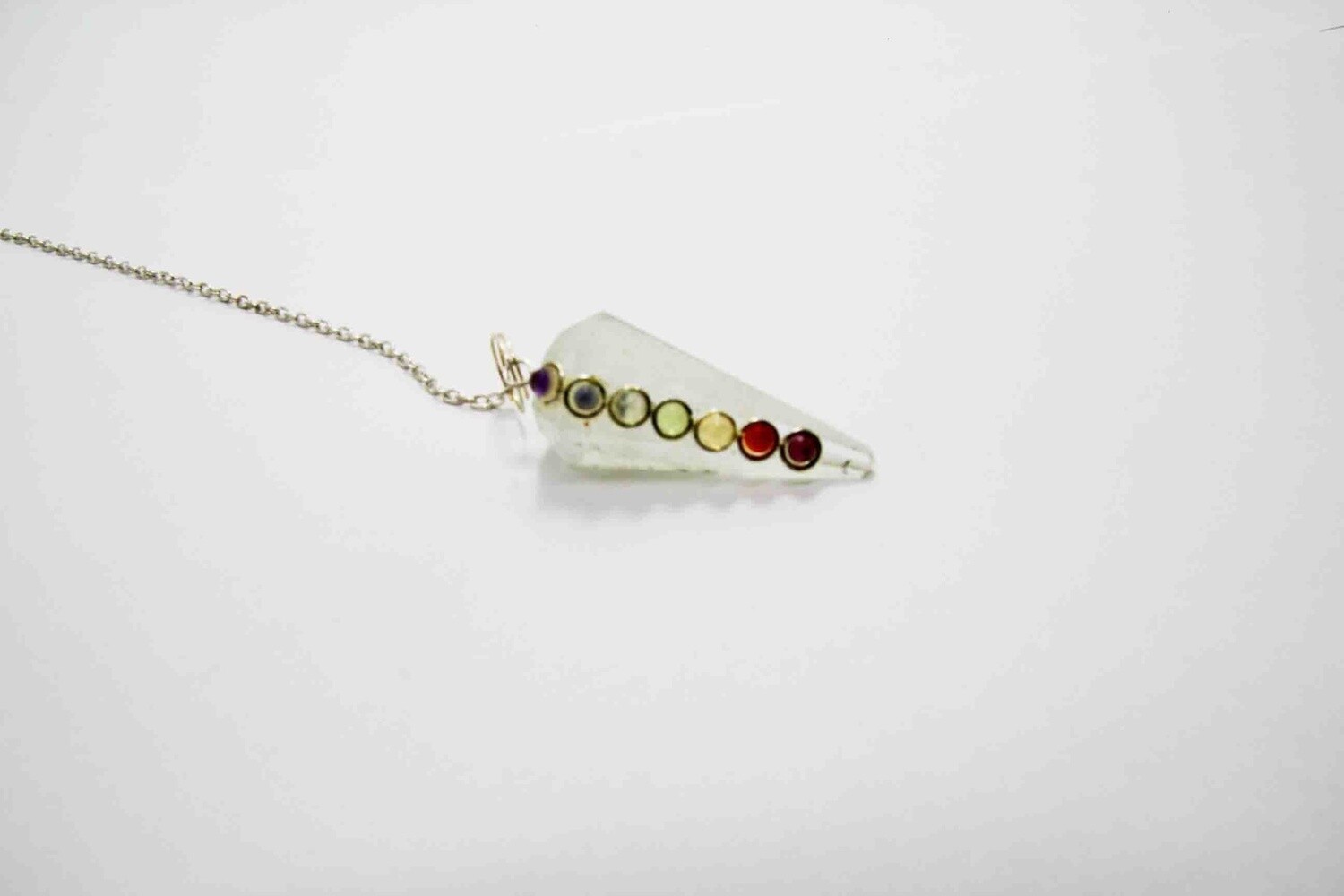 GEMSTONE PENDULUM WITH CRYSTAL FACETTED POINT AND 7 CHAKRA STONES ON STONE 14492