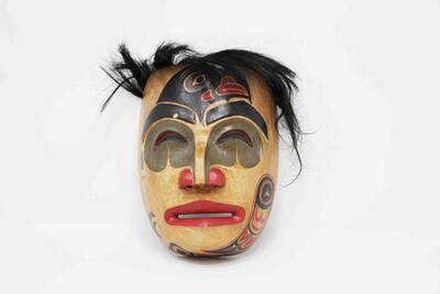 NORTHWEST INDIAN STYLE MASK WITH RAVEN ON FACE IN NATURAL COLOR WITH HAIR OR WITHOUT. HAND CARVED AND PAINTED ALBESIA WOOD. 26346