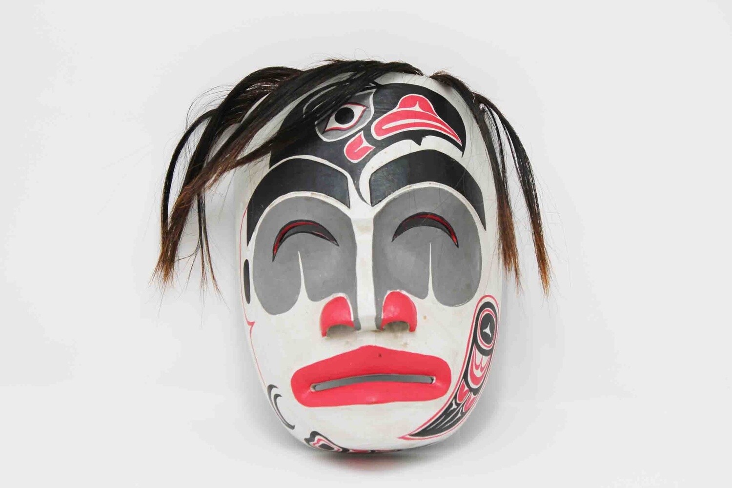 NORTHWEST INDIAN STYLE FACE MASK WITH RAVEN ON FACE IN WHITE MOON OR BLACK MOON. HAND CARVED AND PAINTED ALBESIA WOOD 20085, Item #: 20085-2, Alternate Lookup: ACUX11-123, Vendor Stock #: TAR 18 33 8in 20cm