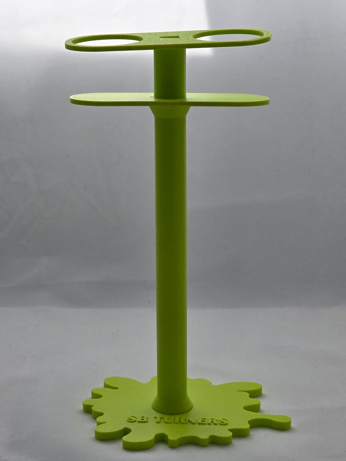 TALL STAND MESSURING MEDICINE CUPS.