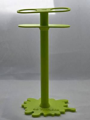 TALL STAND MESSURING MEDICINE CUPS.