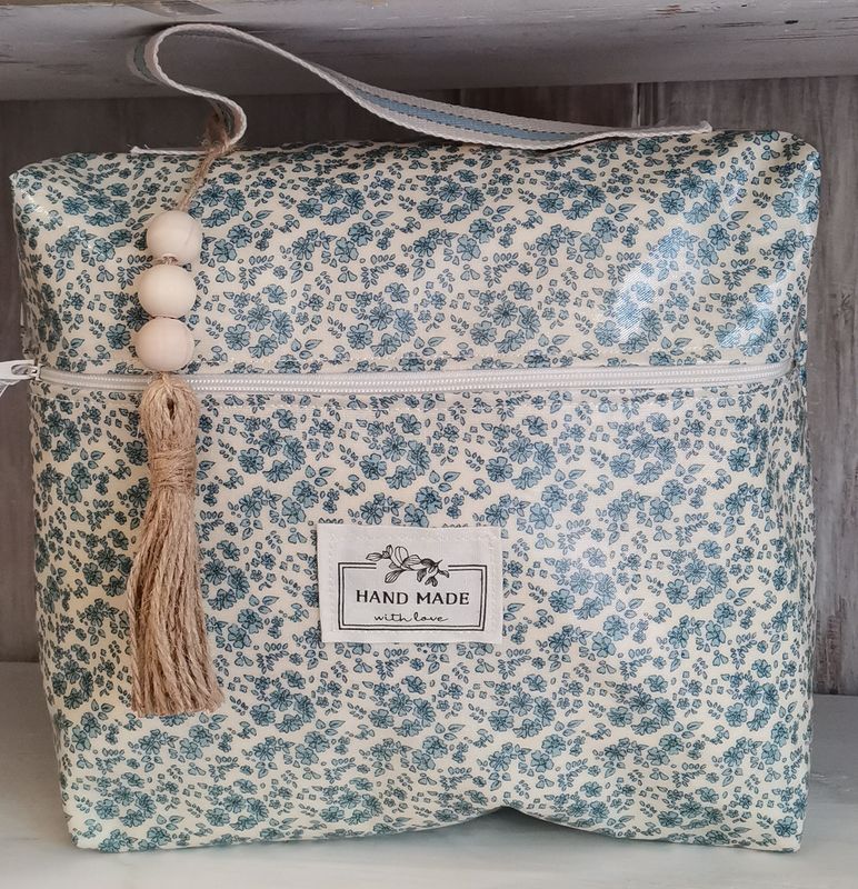 Trousse de toilette à  fleurs blanches et beues