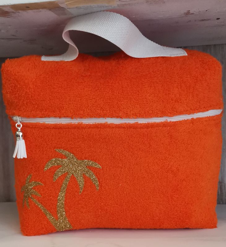 Trousse de toilette en eponge orange &quot;les palmiers&quot; dorés