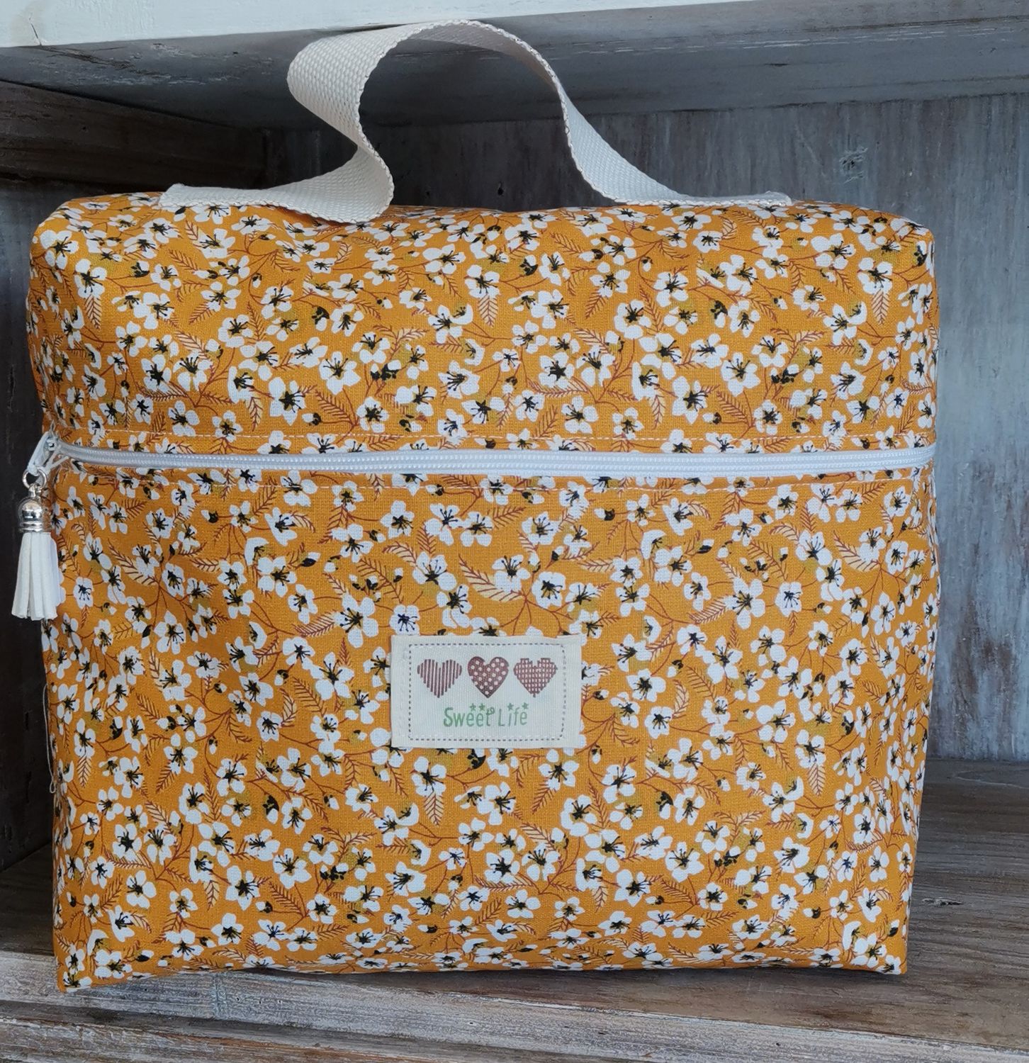 Trousse de toilette jaune à  fleurs blanches