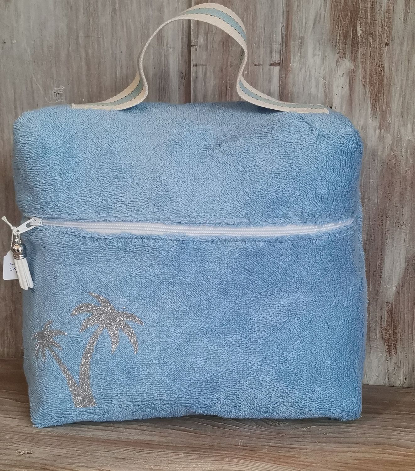 Trousse de toilette en eponge bleu ciel &quot;les palmiers&quot; argentés
