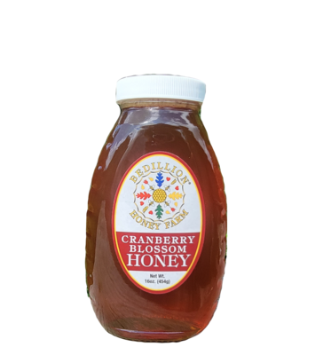 16 oz glass jar of cranberry blossom honey
