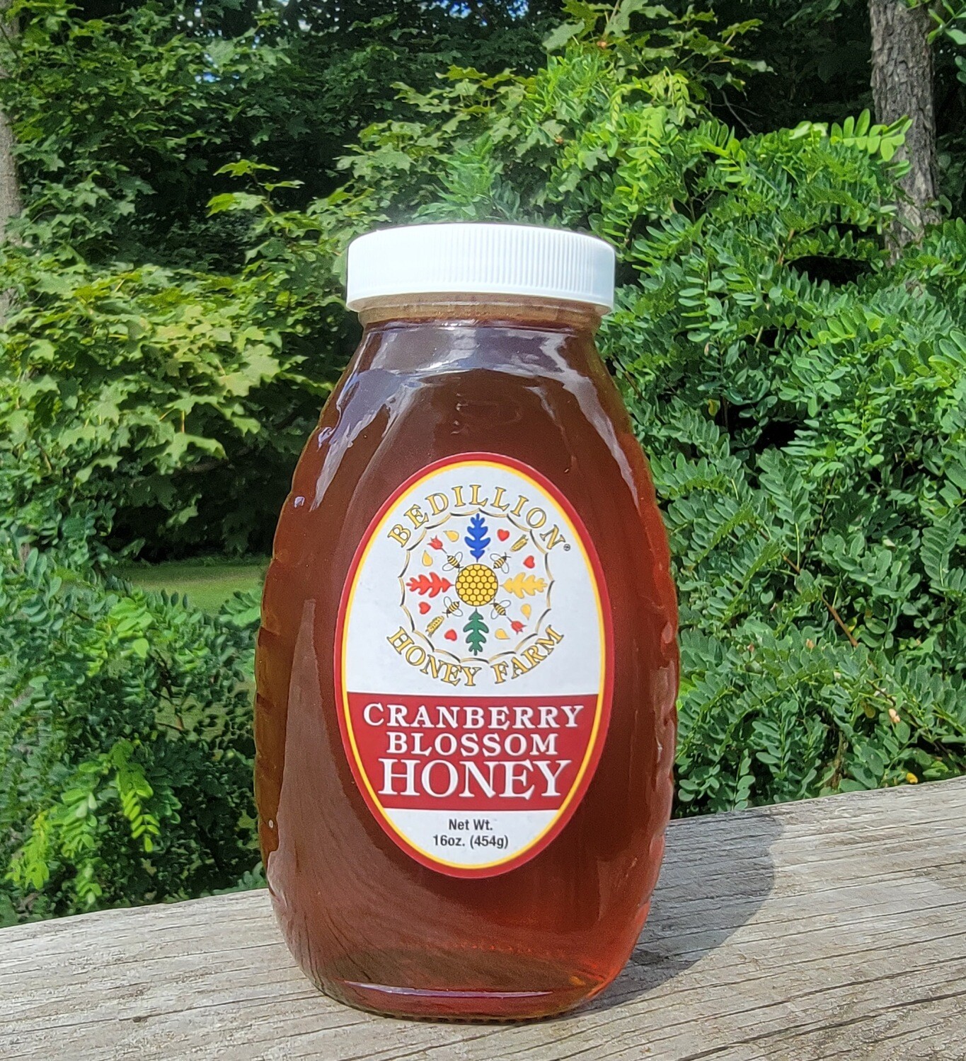 16 oz glass jar of cranberry blossom honey
