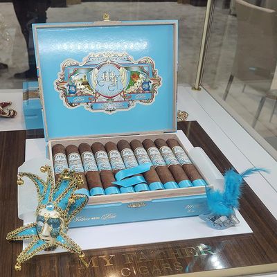 My Father Blue Honduras cigars in a striking sky-blue box with ornate gold and white detailing.