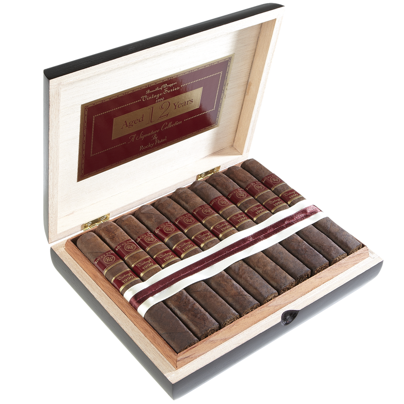 Rocky Patel Vintage 1990 cigars presented in a refined wood box labeled 'Aged 12 Years'.