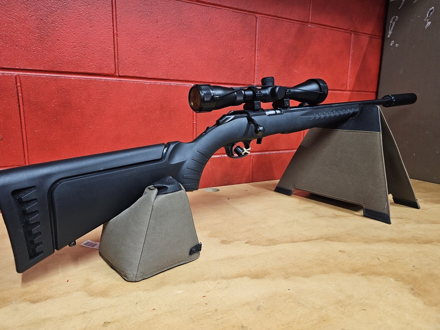 22WMR Ruger Bolt Action with scope and suppressor