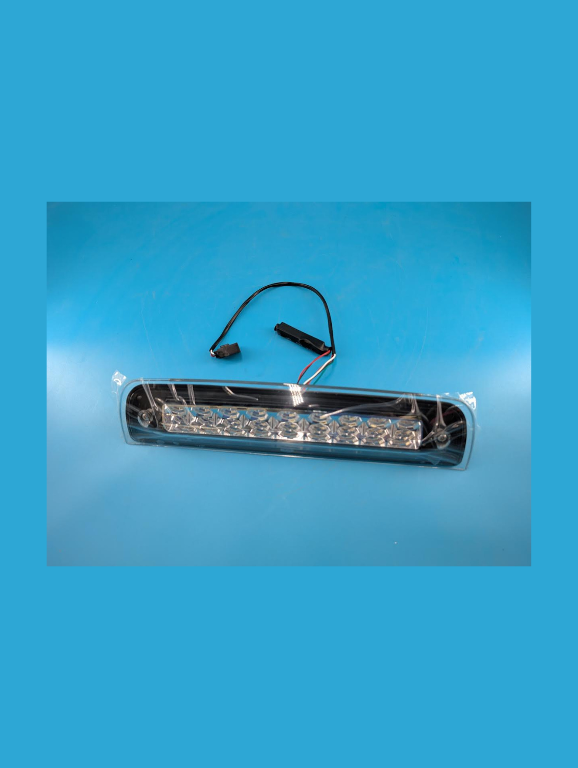 Front of third brake and cargo light for Ram 1500, show plug and play cords