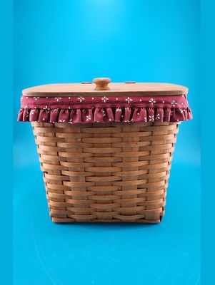 Front view showcases the basket's red ruffle lining.