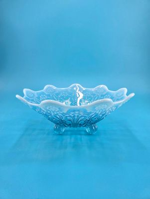Ruffled edges start an opaque white and gradient into clear blue.