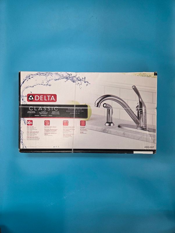 Faucet box front has general specs written.