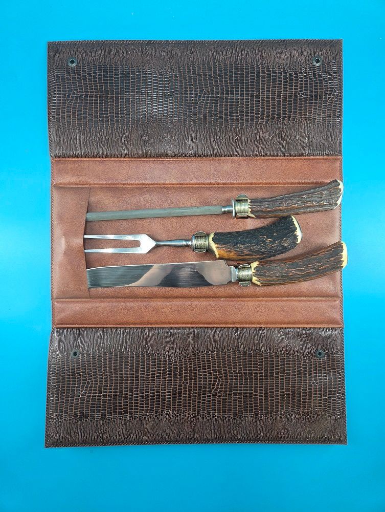 Leather carrying case protects the points of the set.