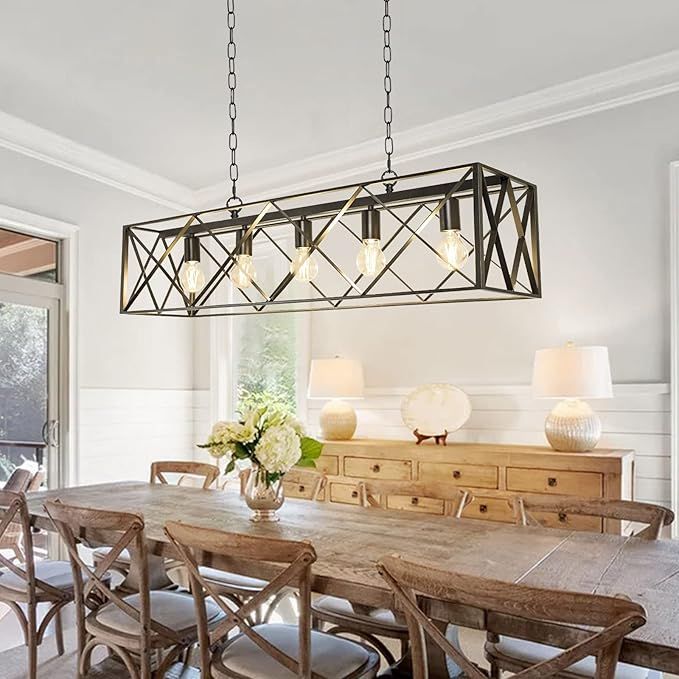 Light fixture hanging over table, Light fixture has criss crossed metal design and 5 lights