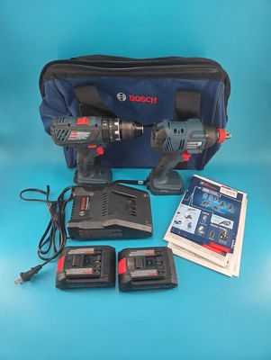 Two power tools, two batteries, one charger, one bag, and instruction booklets.