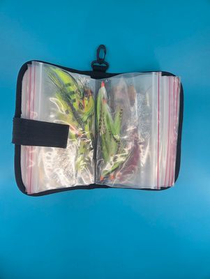 12 baggies filled with various fly fishing lures.