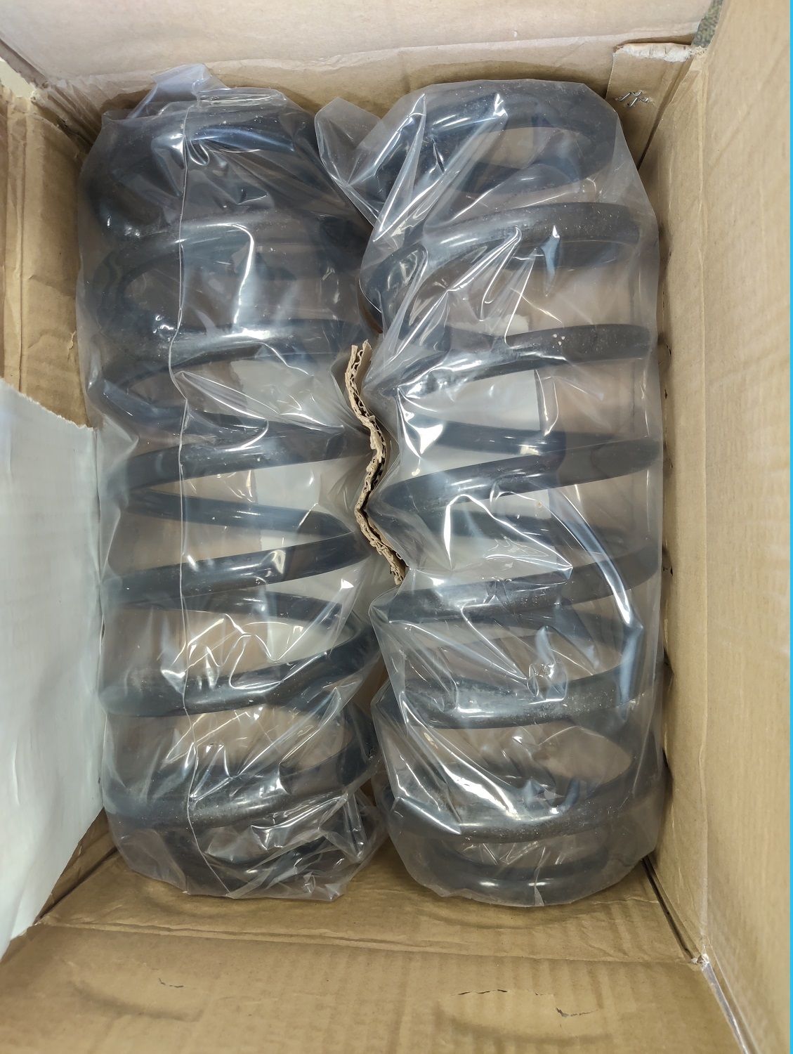 4 A pair of suspension coils, wrapped and in box.