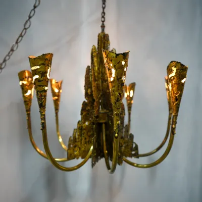 Torch Cut Brutalist Chandelier by Tom Greene for Feldman Co Front view of chandelier, lit.