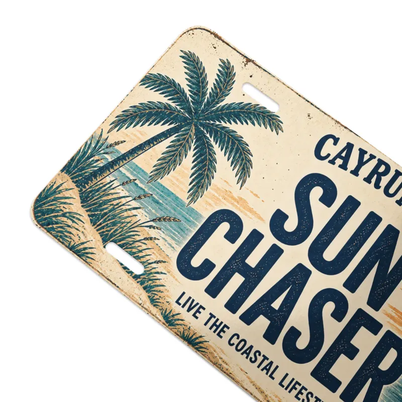 Close-up angled view of Cayrunner Sun Chaser Vanity License Plate, showing palm tree and beach grass artwork.