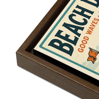 Close-up corner view of Cayrunner Beach Days Framed Canvas, brown wood frame, showing canvas texture and print detail.