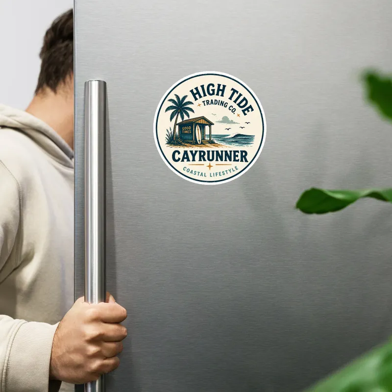 Cayrunner High Tide Trading Co. flexible magnet on a stainless steel refrigerator, person opening fridge door nearby.
