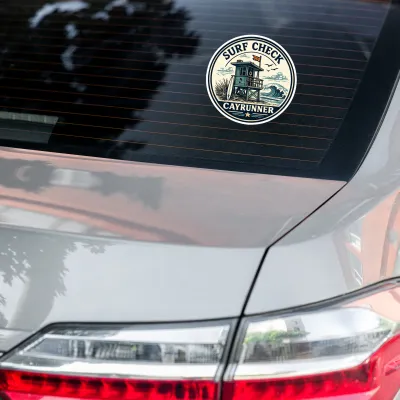Cayrunner Surf Check sticker with lifeguard tower design applied to the rear window of a car.