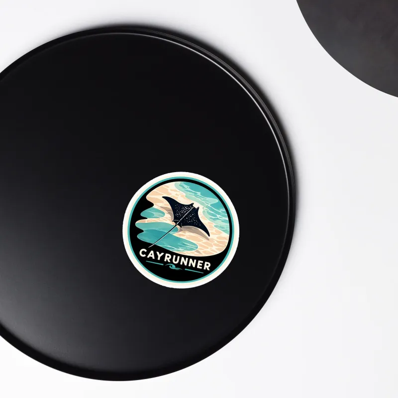 Cayrunner Silent Glide flexible magnet placed on a black round surface, shown close-up against a plain background.