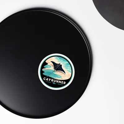 Cayrunner Silent Glide flexible magnet placed on a black round surface, shown close-up against a plain background.