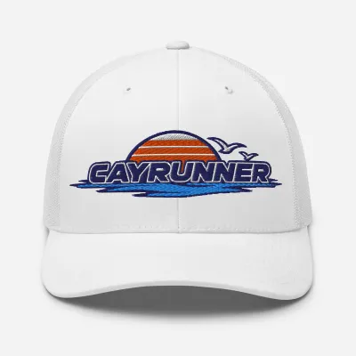 Cayrunner Retro Surf Emblem Trucker Cap in white with embroidered striped sunset, seabirds, waves, and Cayrunner text