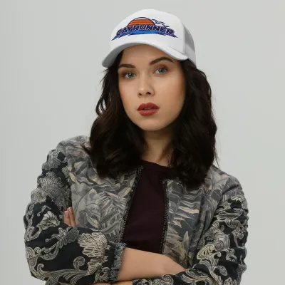 Woman wearing the white Cayrunner Retro Surf Emblem Trucker Cap with an embroidered sunset, seabirds, and waves logo