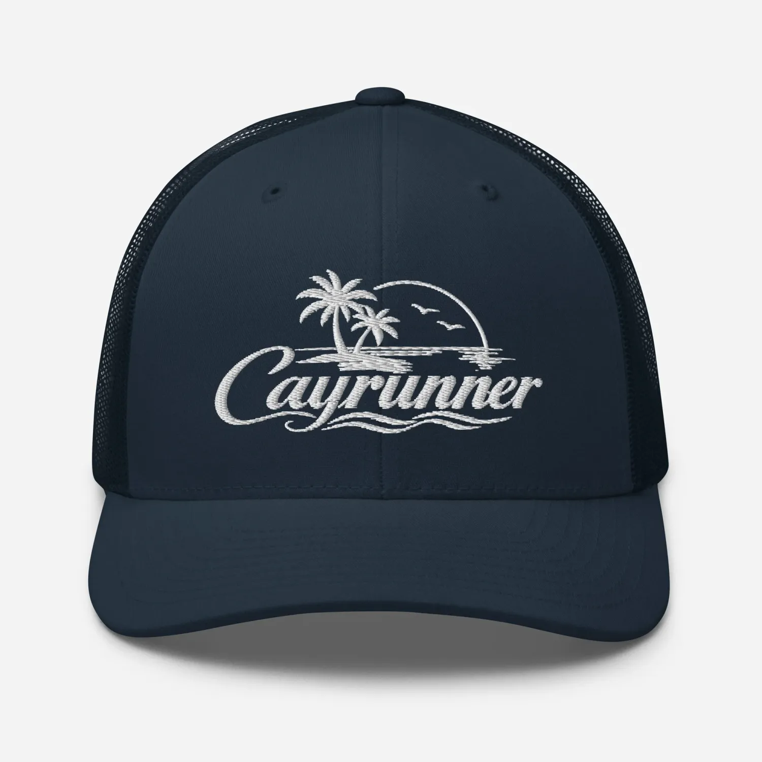 Cayrunner Logo Trucker Cap in navy with white embroidered palm trees, sunset, seabirds, waves, and script Cayrunner text
