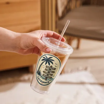 Hand holding Cayrunner Vintage Coastal Surf Sign Clear Plastic Tumbler filled with iced coffee