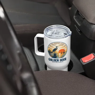Golden Hour Cayrunner Coastal Travel Mug with Handle, sitting in a car cup holder