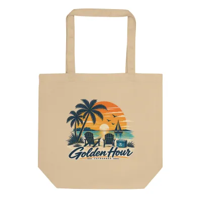 Cayrunner Shoreline Escape organic cotton tote bag, with beach chairs, palms and sunset sailboat