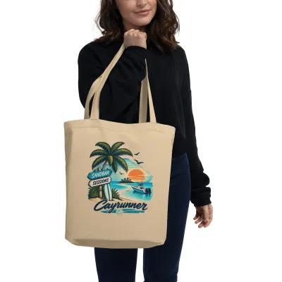 Cayrunner Find Your Sandbar organic cotton tote bag, carried on the shoulder by a woman