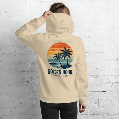 Cayrunner Golden Palms Unisex Hoodie, sand, back view on a woman showing the palm sunset print