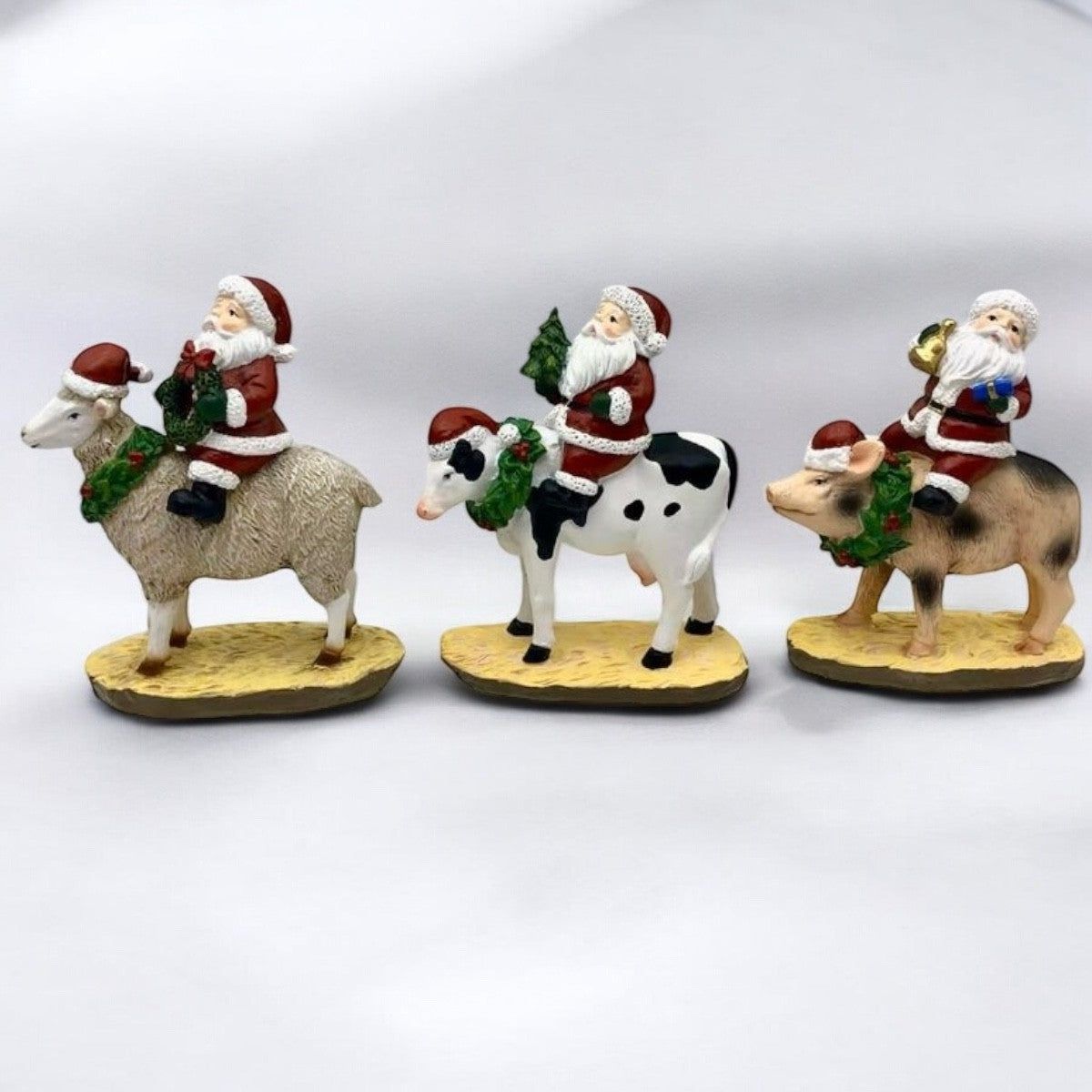Santa on Cow 12cm