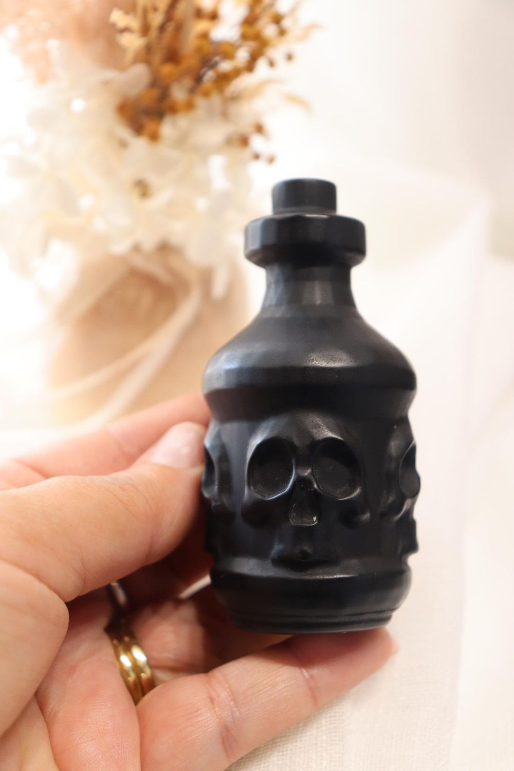 Black Obsidian Cylinder Potion Bottle Skull Faces