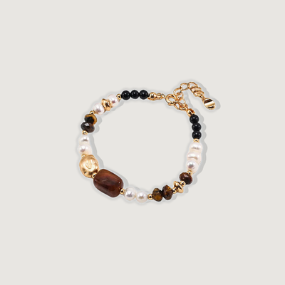 A luxurious bracelet featuring gold and black beads, crafted from 925 silver with tiger eye combined with natural pearls, which symbolize wisdom and purity, this bracelet fosters a sense of balance and inner strength. 