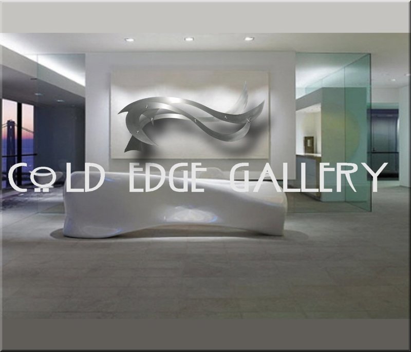 A modern art gallery interior featuring a sleek, abstract metallic artwork on the central wall and a...