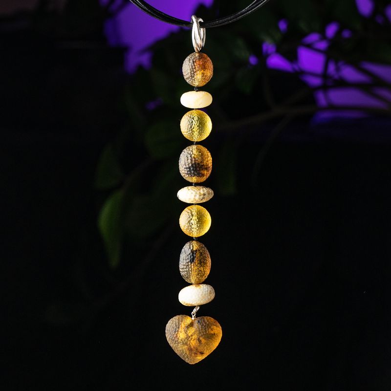 Colorful carved mixed shape vertical amber bead pendant