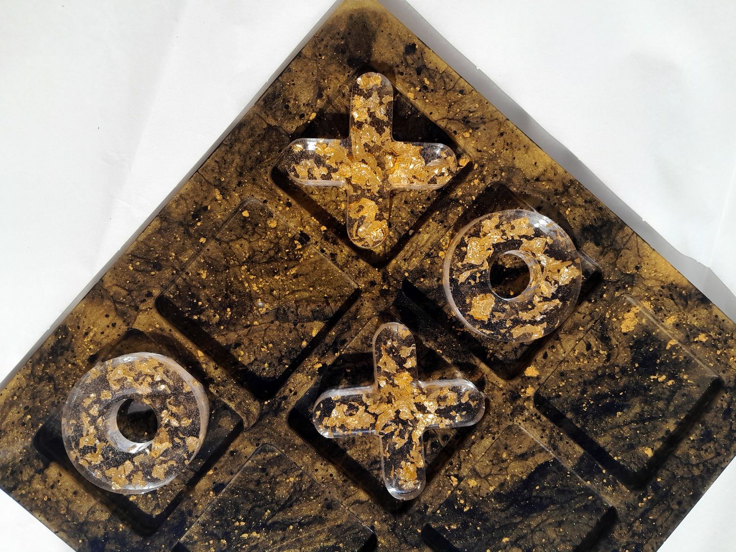 Handmade resin tic-tac-toe board in black and gold